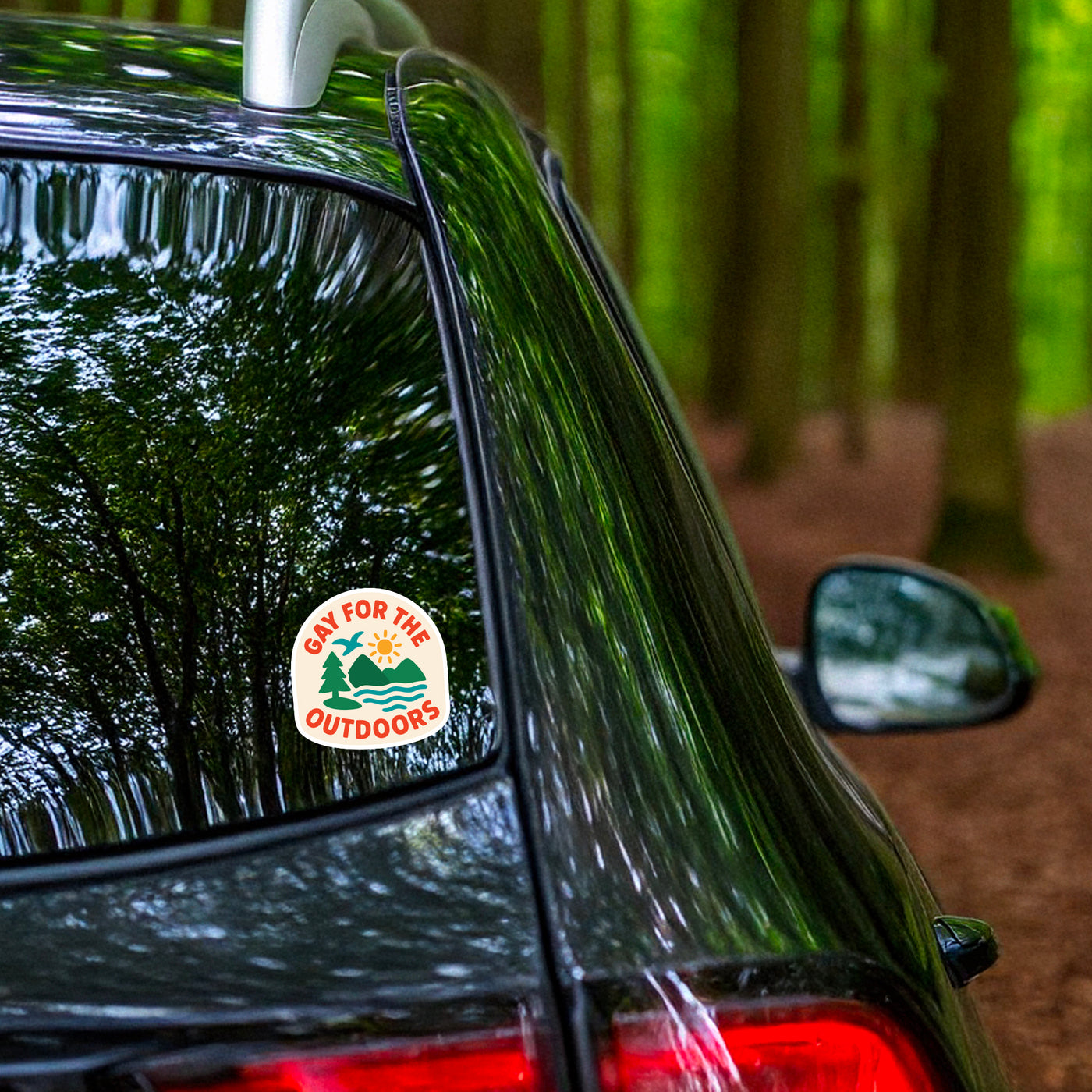 Gay For The Outdoors sticker on car window