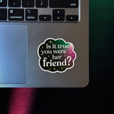 Broadway-inspired vinyl sticker with a quote about friendship, on a silver laptop for queer theater fans